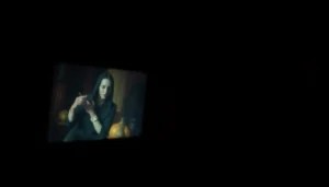 Capture a suspenseful moment of a horror video scene with a creepy figure in shadows, perfect for horror video marketing.